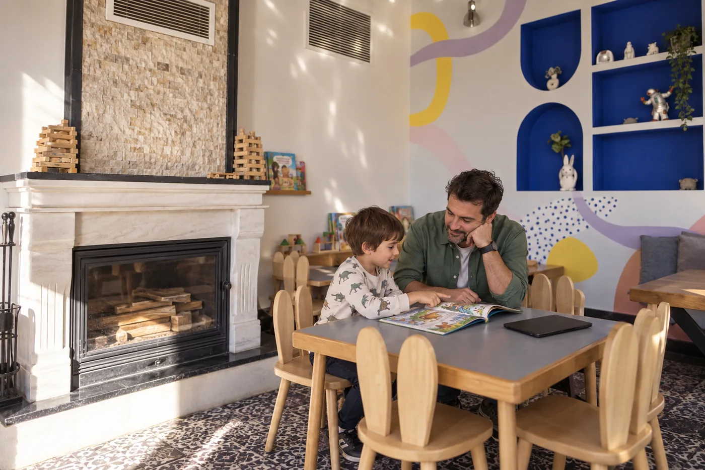 A parent and child discussing viewing choices beside a closed tablet and picture book at a Filifu-inspired table